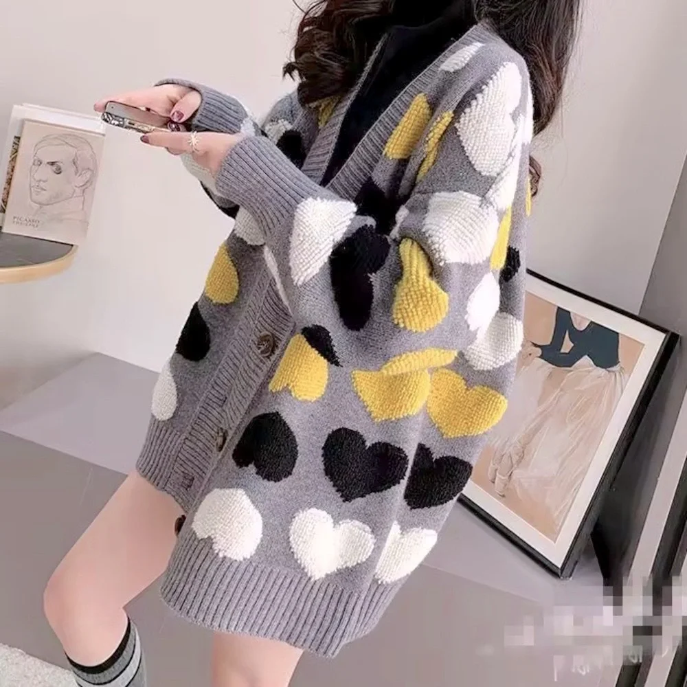 Gray button up cardigan sweater with plush heart pattern